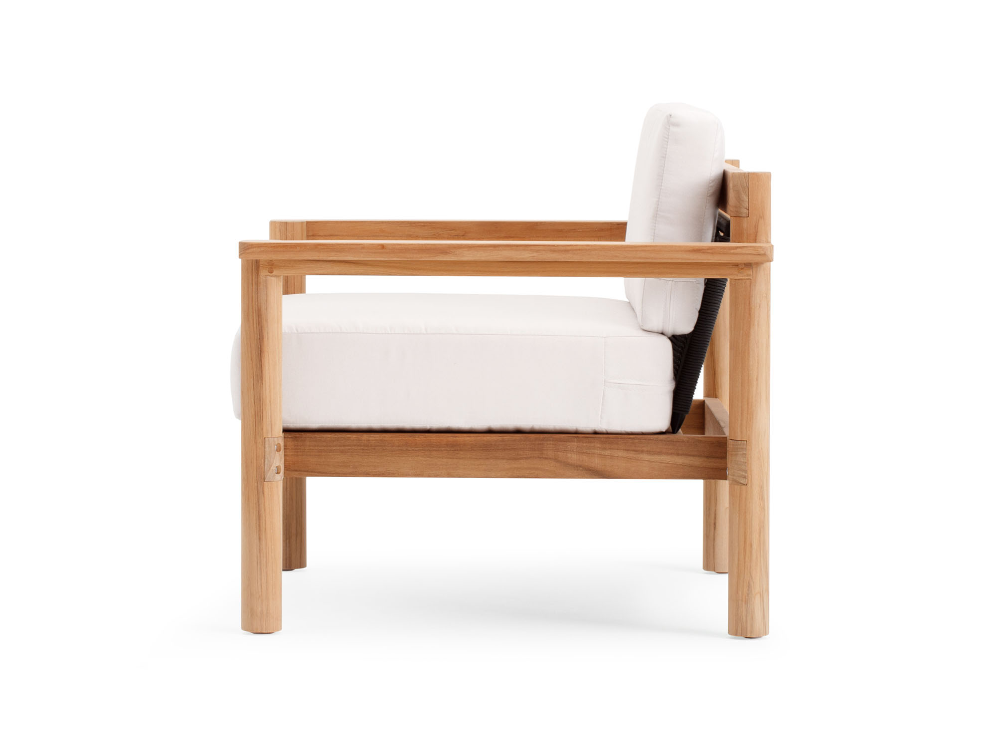 Side view of outdoor chair with white cushions and wood legs